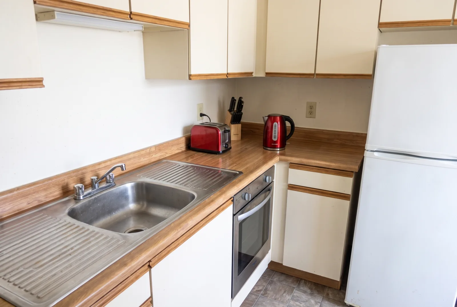 The same kitchen as a bright, clean, professional RoomCast listing photo